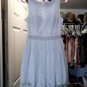 Shirt whit dress, with leave and pearls lining the dress.